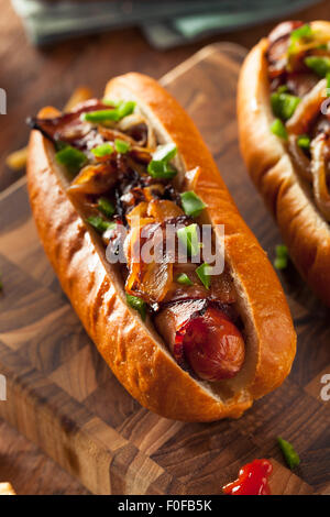 Homemade Bacon Wrapped Hot Dogs with Onions and Peppers Stock Photo