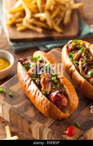 Homemade Bacon Wrapped Hot Dogs with Onions and Peppers Stock Photo