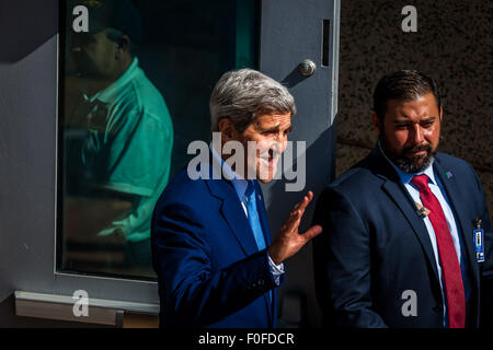 (150814) -- HAVANA, Aug. 14, 2015 (Xinhua) -- U.S. Secretary of State John Kerry (L) waves before the flag raising ceremony at the U.S. Embassy in Havana, Cuba, on Aug. 14, 2015.  Kerry chaired here on Friday the formal ceremony of raising the American flag in the recently reopened U.S. embassy in Cuba, after 54 years of animosity between the two neighbors.  (Xinhua/Liu Bin) Stock Photo