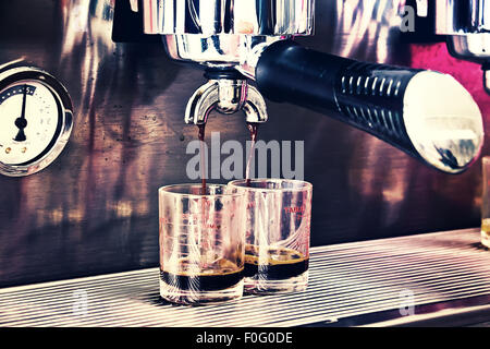 Process of preparation of coffee, a closeup.coffee machine in a cafe Stock Photo