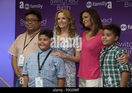 Anaheim, California, USA. 14th Aug, 2015. The Pasiliao family takes a photo with actors Lea Thompson and Constance Marie (Switched at Birth) at the Disney D23 Expo in Anaheim, CA Credit:  Kayte Deioma/Alamy Live News Stock Photo
