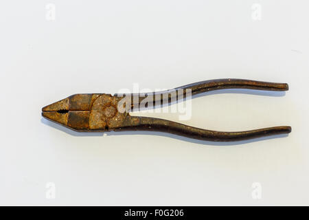 old used black linemans or combination pliers isolated on white background Stock Photo