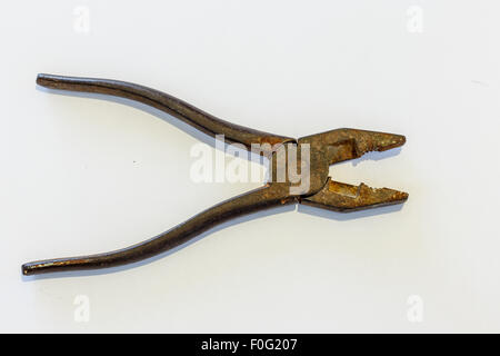 old used black linemans or combination pliers isolated on white background Stock Photo
