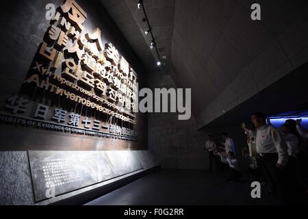 People visit a newly-opened museum about Japanese Army Unit 731 wartime atrocities in Harbin, capital of northeast China's Heilongjiang Province, Aug. 15, 2015. The Museum of Evidence of War Crimes by Japanese Army Unit 731, located on the site of former headquarters of Japanese army unit 731 in Harbin, opened on Saturday. Unit 731 was a biological and chemical warfare research base established in 1935. At least 3,000 people died at the base between 1939 and 1945, mostly in experiments for the development of biological weapons. Stock Photo