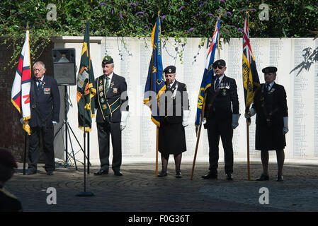 Portsmouth, UK. 15th Aug, 2015. Flag bearers stand to attention during the start of the VJ 70 memorial in Portsmouth. Credit:  MeonStock/Alamy Live News Stock Photo