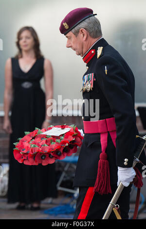 Portsmouth, UK. 15th Aug, 2015. A wreath is brought to be laid at the Portsmouth Cenotaph during the VJ Day 70 memorial. Credit:  MeonStock/Alamy Live News Stock Photo