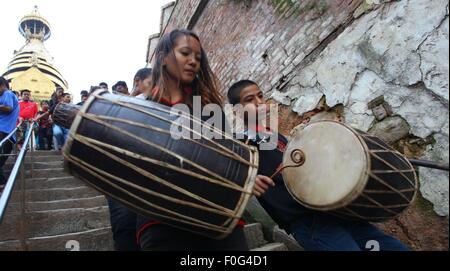 Kathmandu, Nepal. 15th Aug, 2015. People from the Newar community play the traditional drums during the Gunla parva festival at Swayambhunath, Kathmandu, Nepal, Aug. 15, 2015. Credit:  Sunil Sharma/Xinhua/Alamy Live News Stock Photo