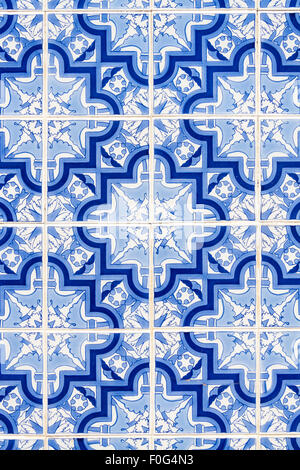 Close detail shot of azulejos, traditional glazed Portuguese tiles on an exterior wall in the Algarve Stock Photo