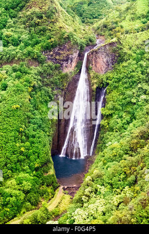 A view of Jurassic falls in the interior of Kauai Island, Hawaii shot from a door-free helicopter