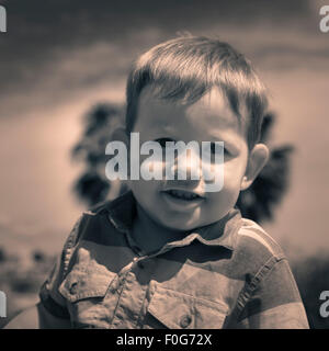 Portrait of cute smiling child boy outdoors. Stock Photo