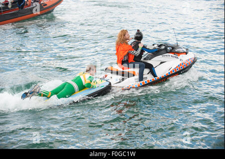 Worthing, UK. 15th Aug, 2015. The safety team bring competitors back to the beach. The Worthing International Birdman Festival 2015 Credit:  Stephen Bartholomew/Alamy Live News Stock Photo