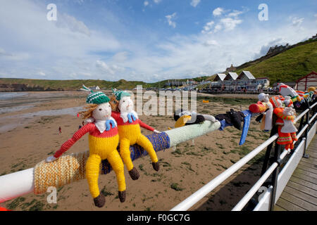 Knitted Yarn Bombing sculptures on the pier at Saltburn in Yorkshire, UK Stock Photo