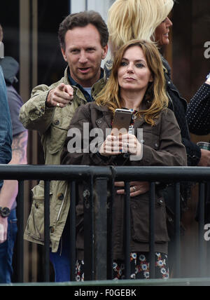 Geri Halliwell cuddles up to new husband Christian Horner at the Isle of Wight Festival as they watch the main stage. Former band-mate, Mel C was also with them briefly.  Featuring: Geri Halliwell, Christian Horner Where: Isle Of Wight, United Kingdom When: 14 Jun 2015 Stock Photo