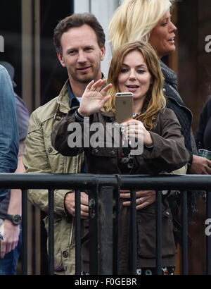 Geri Halliwell cuddles up to new husband Christian Horner at the Isle of Wight Festival as they watch the main stage. Former band-mate, Mel C was also with them briefly.  Featuring: Geri Halliwell, Christian Horner Where: Isle Of Wight, United Kingdom When: 14 Jun 2015 Stock Photo