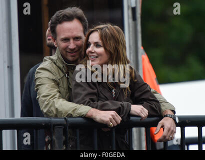 Geri Halliwell cuddles up to new husband Christian Horner at the Isle of Wight Festival as they watch the main stage. Former band-mate, Mel C was also with them briefly.  Featuring: Geri Halliwell, Christian Horner Where: Isle Of Wight, United Kingdom When: 14 Jun 2015 Stock Photo