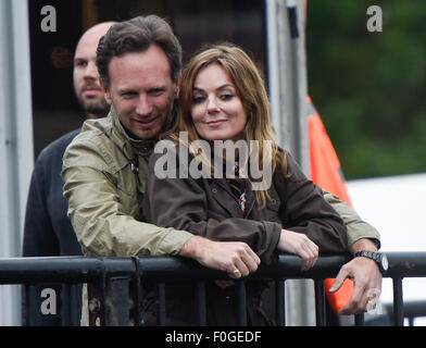 Geri Halliwell cuddles up to new husband Christian Horner at the Isle of Wight Festival as they watch the main stage. Former band-mate, Mel C was also with them briefly.  Featuring: Geri Halliwell, Christian Horner Where: Isle Of Wight, United Kingdom When: 14 Jun 2015 Stock Photo