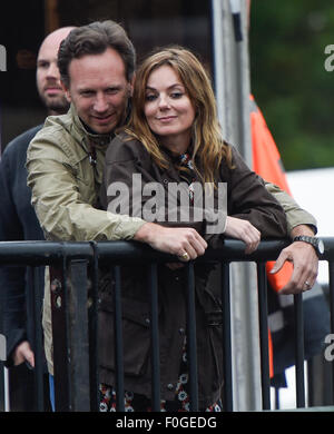 Geri Halliwell cuddles up to new husband Christian Horner at the Isle of Wight Festival as they watch the main stage. Former band-mate, Mel C was also with them briefly.  Featuring: Geri Halliwell, Christian Horner Where: Isle Of Wight, United Kingdom When: 14 Jun 2015 Stock Photo