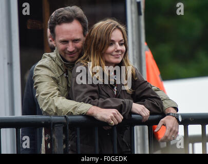 Geri Halliwell cuddles up to new husband Christian Horner at the Isle of Wight Festival as they watch the main stage. Former band-mate, Mel C was also with them briefly.  Featuring: Geri Halliwell, Christian Horner Where: Isle Of Wight, United Kingdom When: 14 Jun 2015 Stock Photo