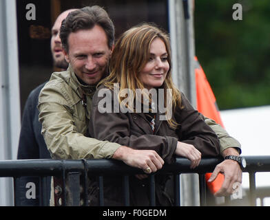 Geri Halliwell cuddles up to new husband Christian Horner at the Isle of Wight Festival as they watch the main stage. Former band-mate, Mel C was also with them briefly.  Featuring: Geri Halliwell, Christian Horner Where: Isle Of Wight, United Kingdom When: 14 Jun 2015 Stock Photo