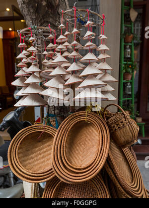 Souvenir woven baskets and miniature conical hats for sale in Hanoi Vietnam Stock Photo