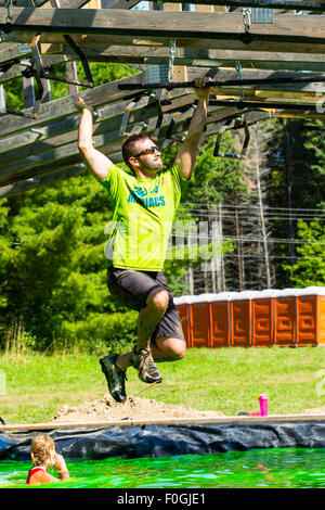 Toronto, Canada. 15th Aug, 2015. Tough Mudder Obstacle Course Aug 15 2015 Toronto Ontario. Funky monkey obstacle Credit:  Performance Image/Alamy Live News Stock Photo