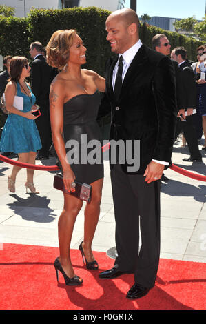 LOS ANGELES, CA - AUGUST 21, 2010: Spice Girl Melanie Brown, aka Mel B. & husband Stephen Belafonte at the 2010 Creative Arts Emmy Awards at the Nokia Theatre L.A. Live. Stock Photo