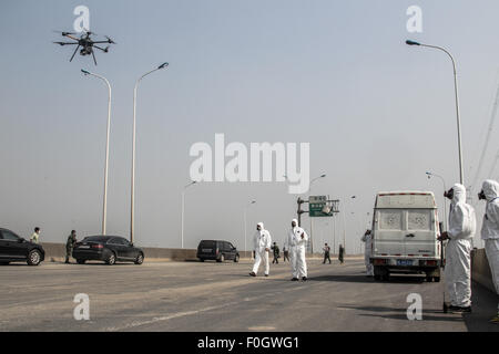 Tianjin. 16th Aug, 2015. Workers map using a drone near the explosion ...