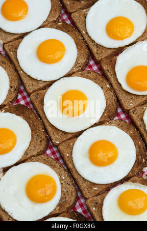 Fried eggs on toast pattern Stock Photo