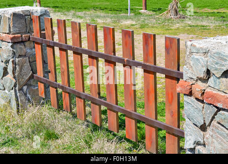 Closeup of a brown wooden fence in the village in bright colors Stock Photo