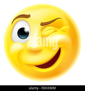 A happy winking emoji emoticon smiley face character winking one eye Stock Photo