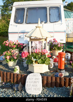 Designed garden in front of a caravan on campsite UK Stock Photo