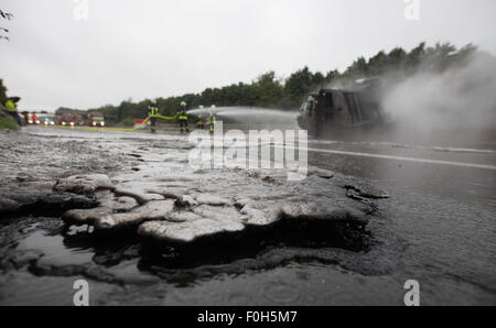 Schwerte, Germany. 16th Aug, 2015. Firemen put out a lorry in Schwerte ...