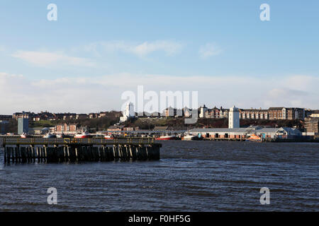 The High Light and Low Light towers stand by the fishing harbour in North Shields, England. Staiths stand on the River Tyne. Stock Photo