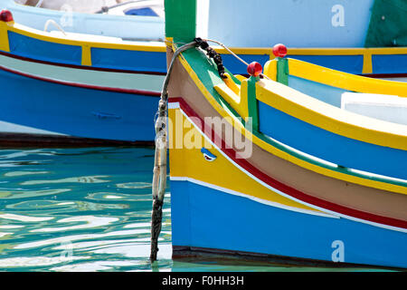 Fishing boats in Malta displaying the 'eye of Osiris' which is painted on all boats to ward off evil spirits Stock Photo
