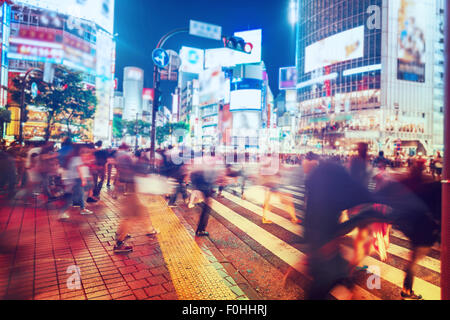 People and vehicles cross the famously busy Shibuya intersection in Tokyo Stock Photo