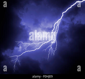huge lightning bolt in dark stormy sky Stock Photo