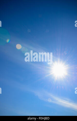 Sun and sky with lens flare background Stock Photo