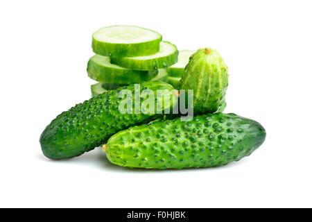 Cucumbers and slices isolated over white background Stock Photo