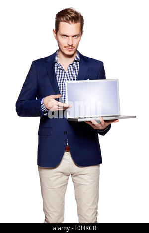 Young businessman is showing something on a computer. Isolated on white background. Stock Photo