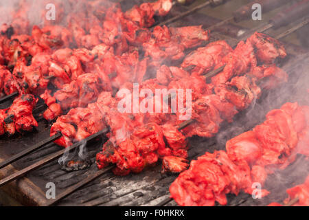 Chicken kebabs on a large catering griddle at an outdoor event, Birmingham UK Stock Photo