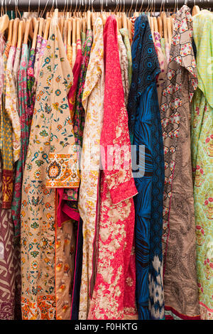 Asian Indian or Pakistani women's clothes on a rack for sale in an outdoor event, Birmingham UK Stock Photo