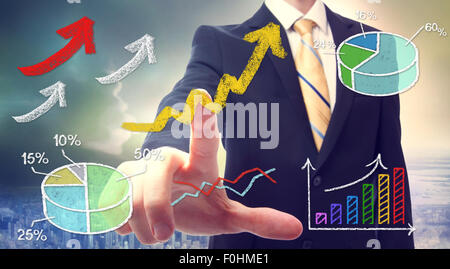 Businessman pointing at rising arrows and graph cartoon Stock Photo