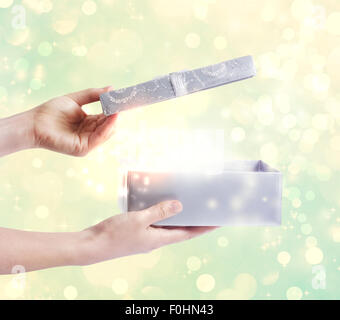 A magical glowing present box being opened Stock Photo