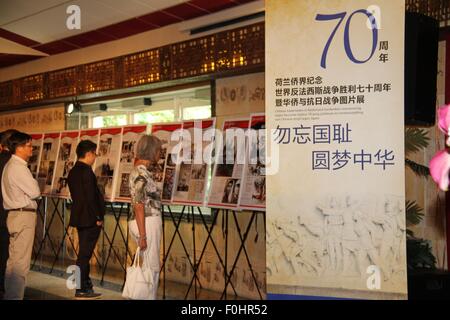 (150816) -- UTRECHT, Aug. 16, 2015 (Xinhua) -- People visit the photo exhibition marking the 70th anniversary of the victory of anti-Japanese War in Utrecht, the Netherlands, on Aug. 16, 2015. 'Seventy years on, large quantities of chemical weapons abandoned by Japan are still widely located in China. We urge Japan to accelerate the destruction of these weapons,' China's ambassador to The Netherlands and representative to the Organisation For the Prohibition of Chemical weapons (OPCW) Chen Xu said on Saturday during the opening ceremony of a photo exhibition marking the 70th anniversary of th Stock Photo