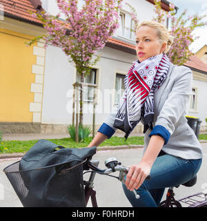 Woman riding bicycle. Stock Photo