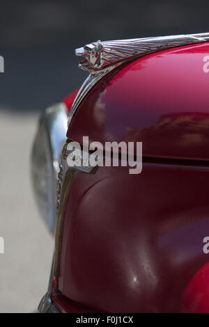 Detail of the front side of a red Peugeot vintage car on rally of classical cars in Paris 2012, France. Stock Photo