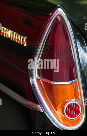 The rear brake lights of an old black vintage car in Paris, May 2012 Stock Photo