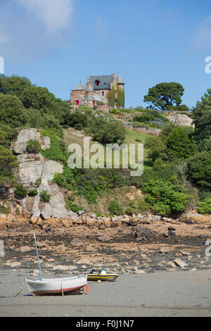 House and small boats on Brehat island in brittany. Cotes d'Armor during a sunny day. France Stock Photo