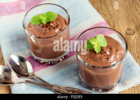 Chocolate mousse with mint in portion glasses Stock Photo