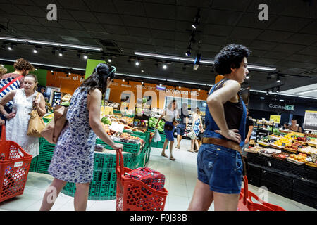 Madrid Spain,Europe,Spanish,Hispanic Latin Latino ethnic immigrant immigrants minority,Centro,Plaza de Lavapias,Carrefour Market,supermarket,grocery s Stock Photo
